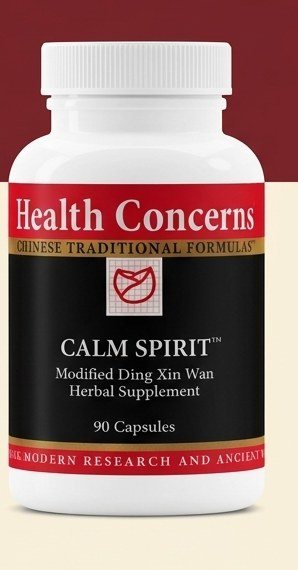 Calm Spirit, 90 capsules, standing where a heritage-red wall meets a cream floor
